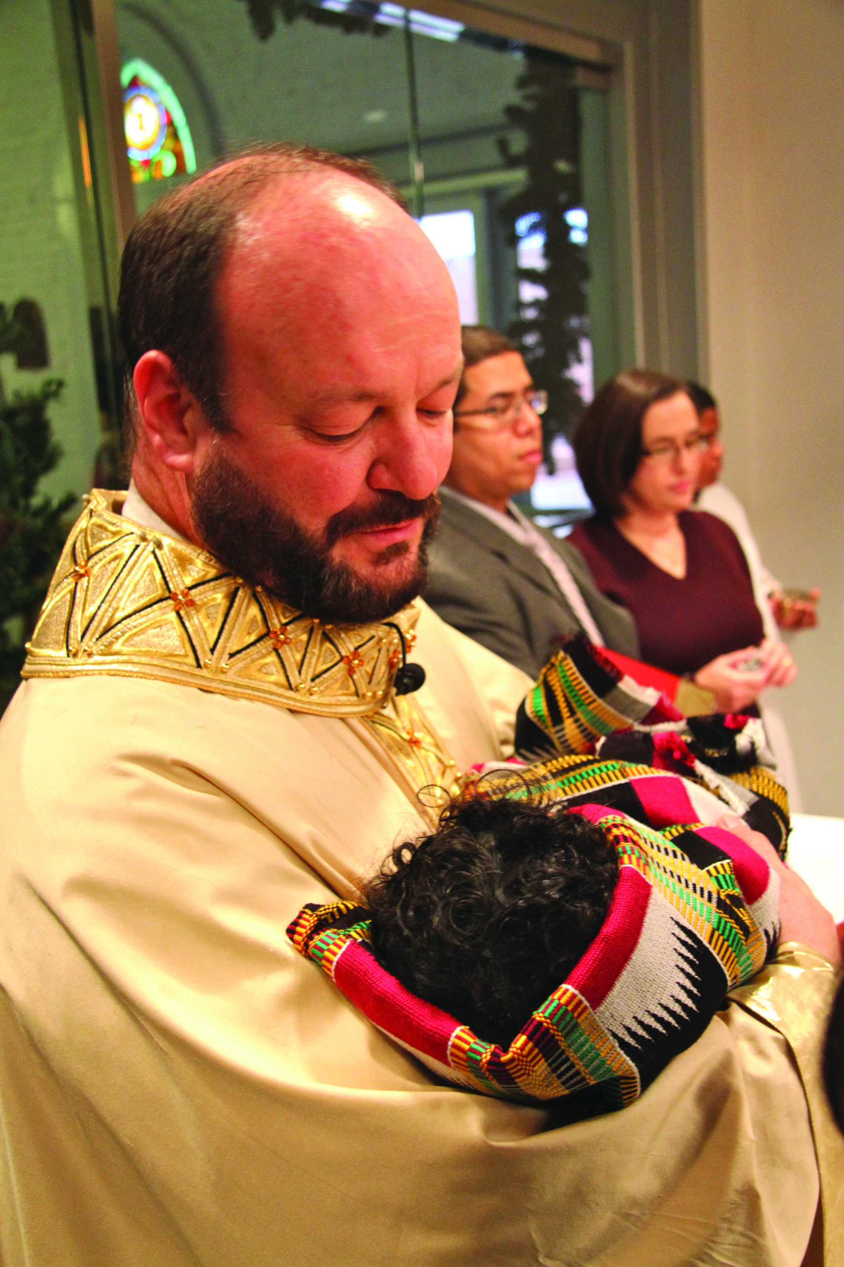 Holy Redeemer Fausz holding baby